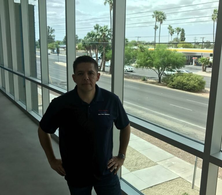 man standing near the window